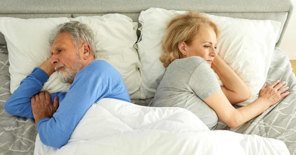 There’s a certain type of silence that only happens in long marriages — two people eating dinner at the same table, moving around the same kitchen, going through the same routines, and neither of them has said anything that required the other to actually listen in maybe a year, and they’re not openly unhappy, they’re just no longer curious