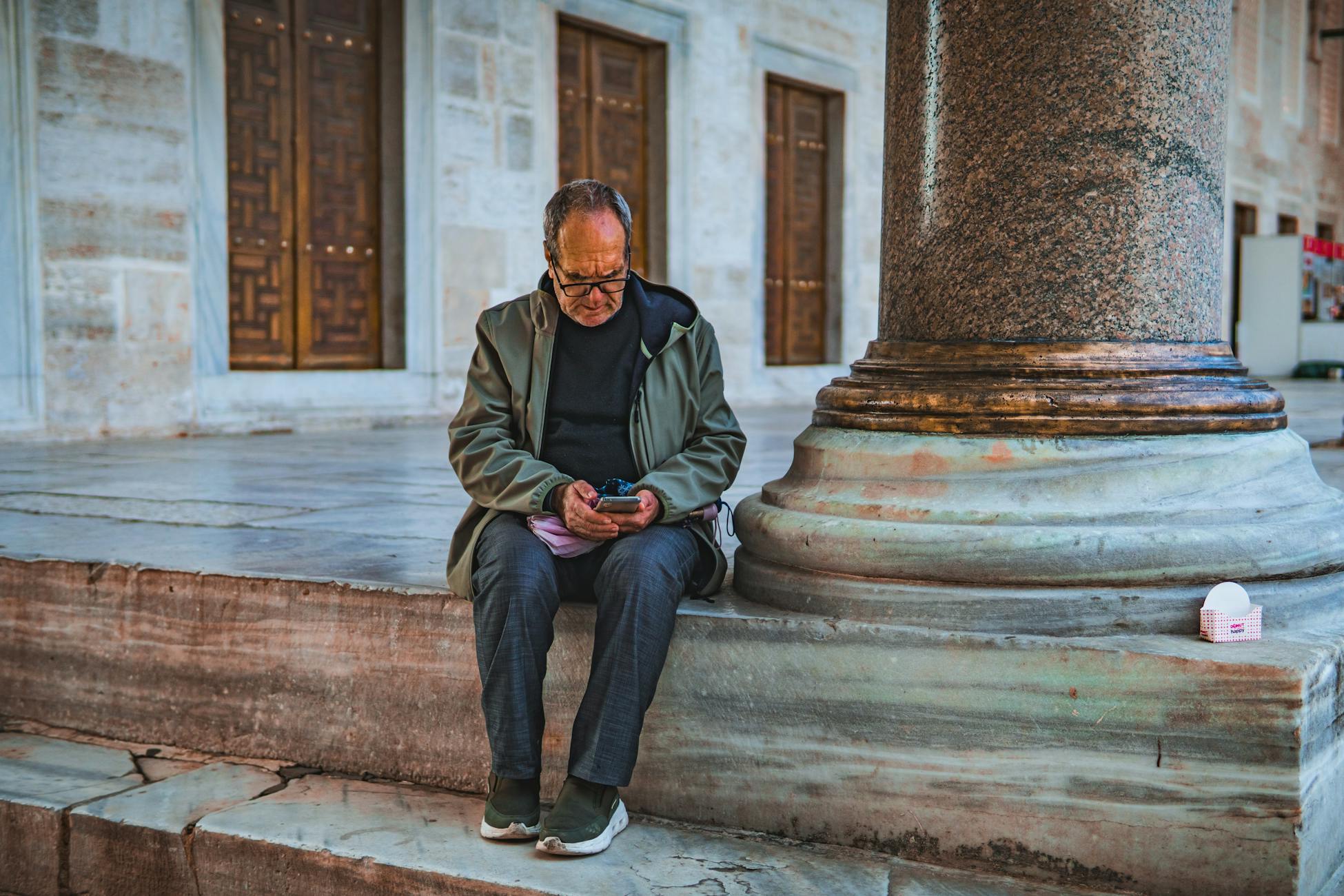 elderly man sitting alone