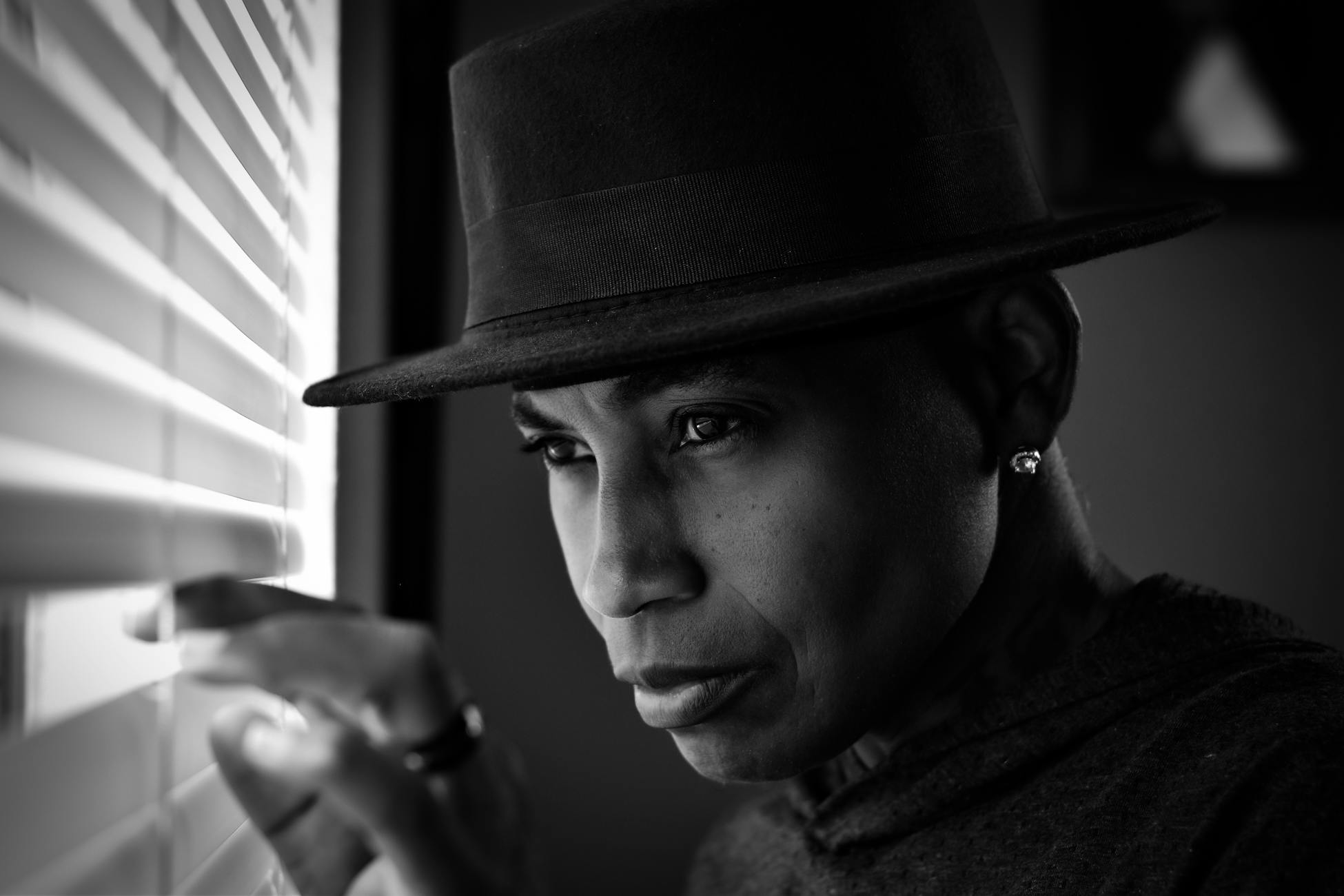 woman looking through window