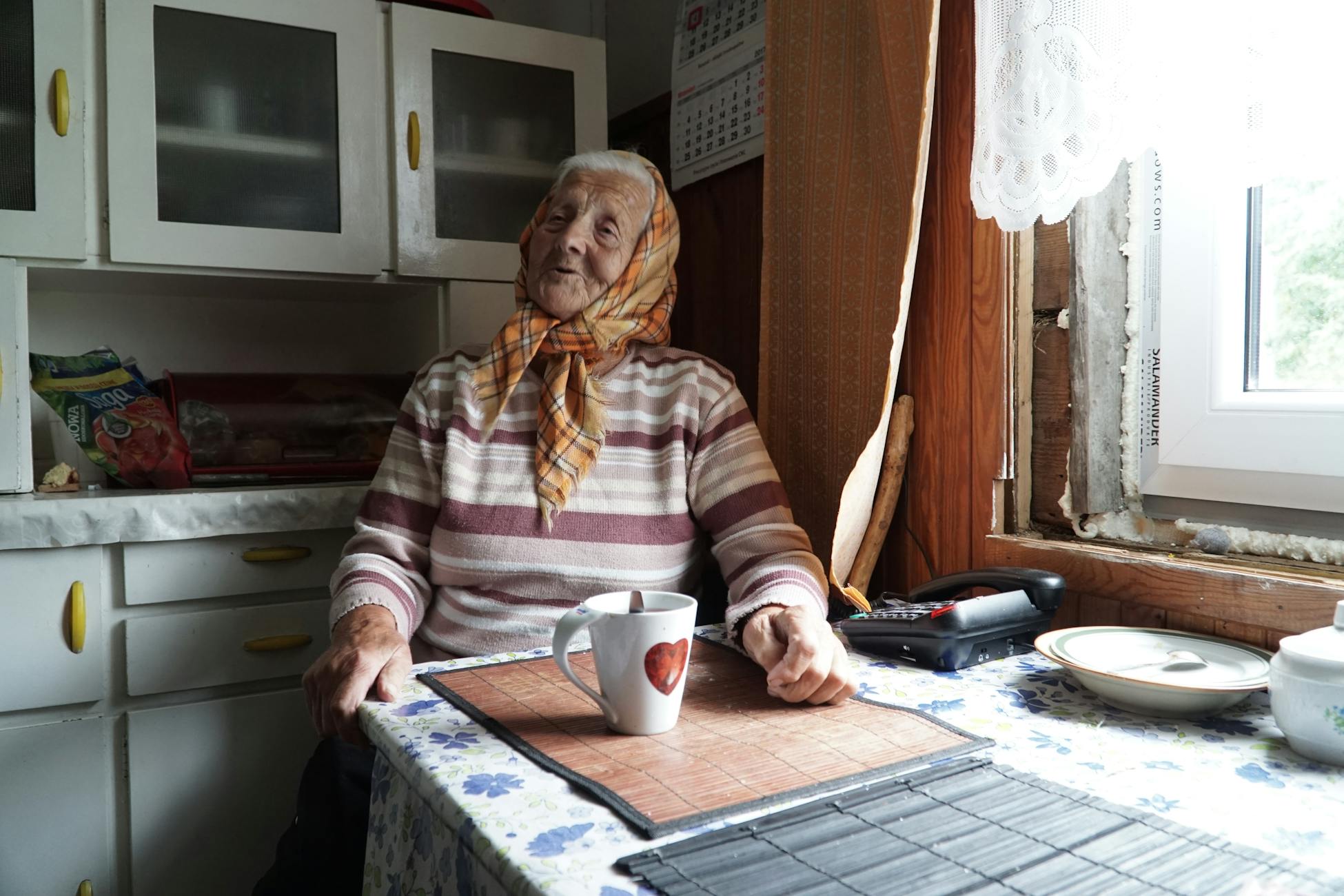 elderly woman kitchen morning
