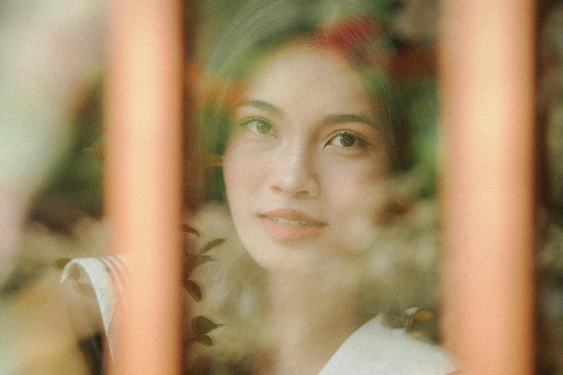 woman looking out window reflection