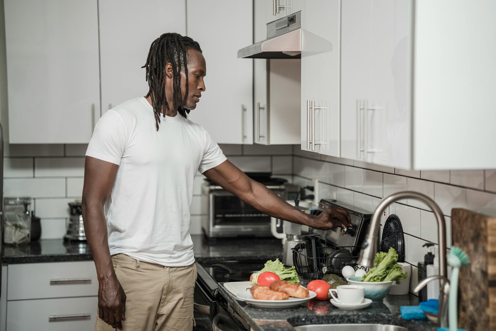 man cooking kitchen morning